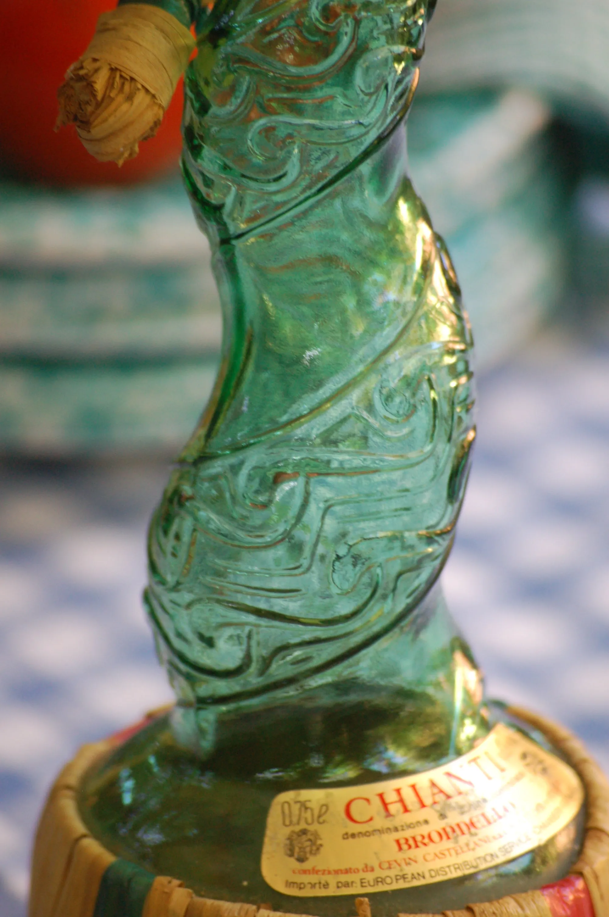 Large Vintage Emerald green Spiral glass decanter from Empoli, Italy. Spiral design with floral convolute embossing. Genie bottle