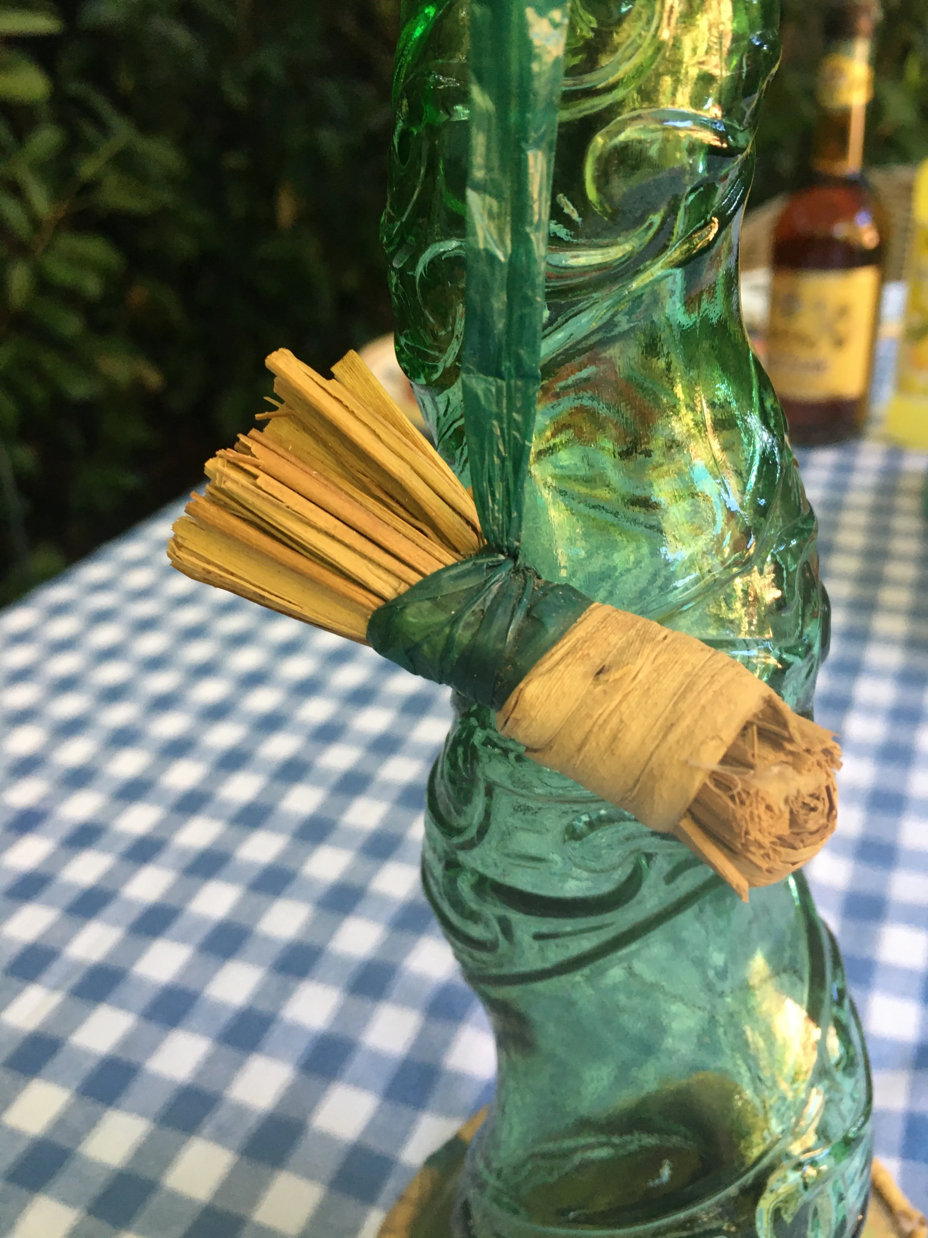 Large Vintage Emerald green Spiral glass decanter from Empoli, Italy. Spiral design with floral convolute embossing. Genie bottle