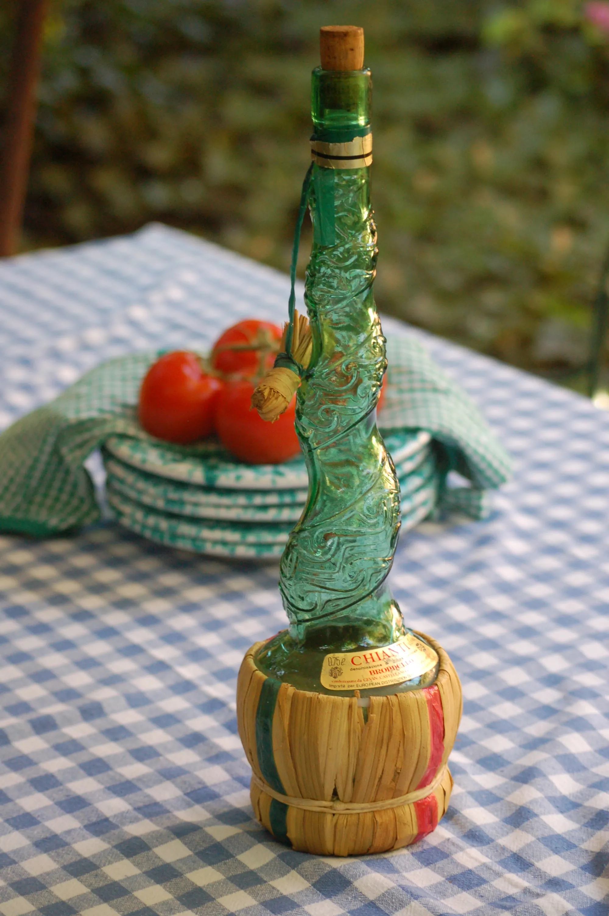 Large Vintage Emerald green Spiral glass decanter from Empoli, Italy. Spiral design with floral convolute embossing. Genie bottle